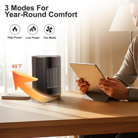 Person using a tablet next to a small heater on a desk with text indicating '3 Modes For Year-Round Comfort'.