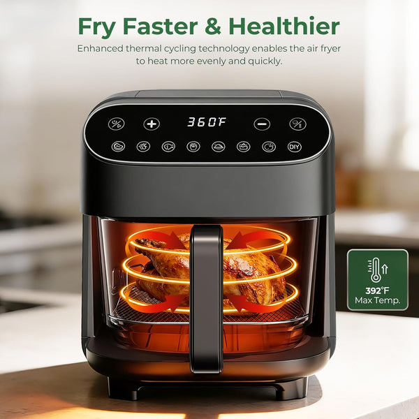 Air fryer with digital display showing temperature, set on a kitchen counter.