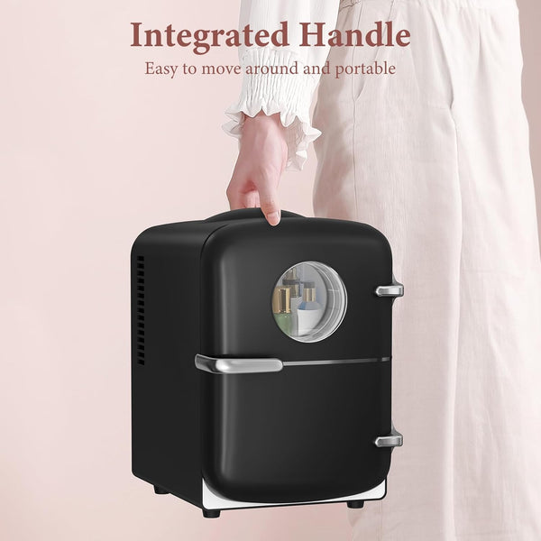 Black portable cooler with integrated handle on a light pink background