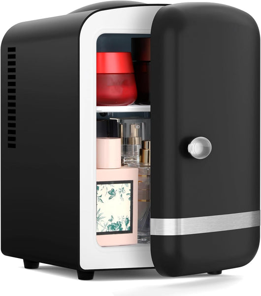 Black mini refrigerator with open door displaying various items on a white background