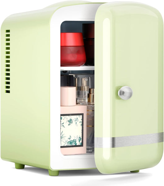 Small green refrigerator with open door displaying various items on a white background