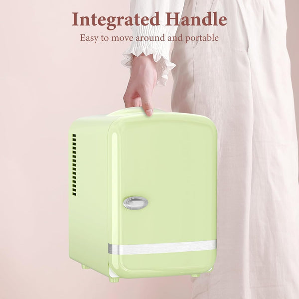 Green suitcase with an integrated handle, held by a person, on a light pink background.