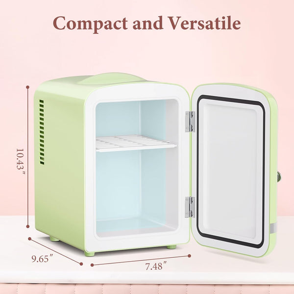 Compact green refrigerator with open door on a pink background, dimensions displayed.