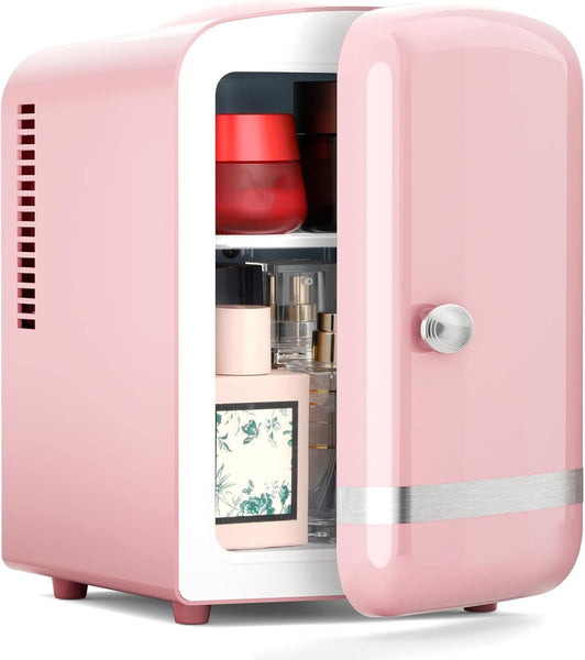 Pink mini refrigerator with cosmetic products inside on a white background
