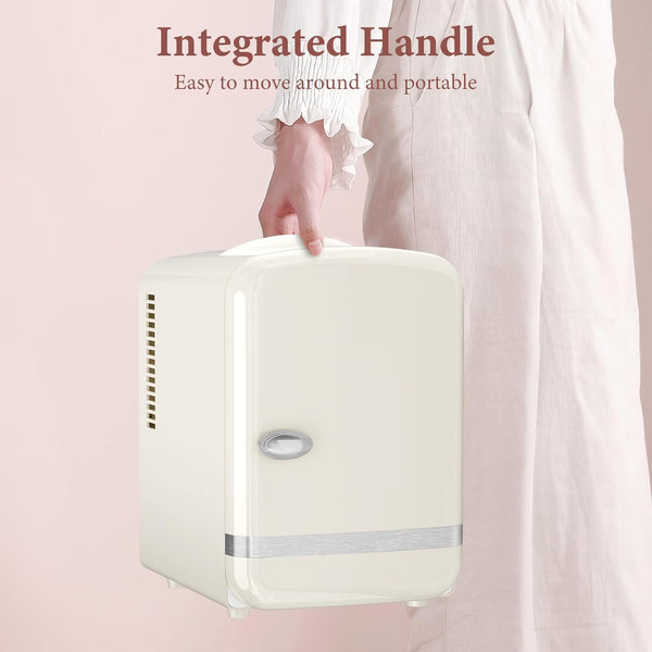 Small white refrigerator with an integrated handle on a pink background