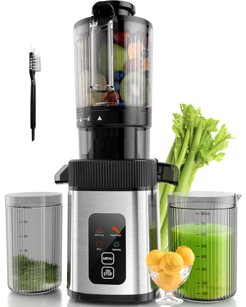 Juicer with ingredients and a glass of green juice on a white background