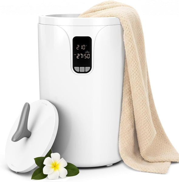 White humidifier with digital display, beige towel, and white flower on a white background