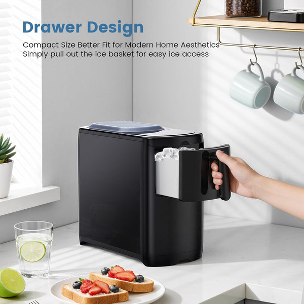 Black ice maker with open door on a kitchen counter, showing ice cubes being pulled out.