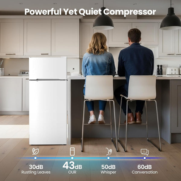 Two people sitting at a kitchen counter with a refrigerator labeled 'Powerful Yet Quiet Compressor'.