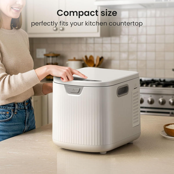 White kitchen appliance on a countertop with text highlighting its compact size.