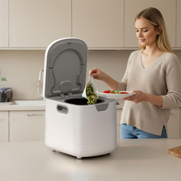 Person disposing food waste into a kitchen compost bin in a modern kitchen.