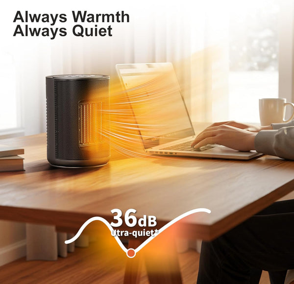 Person using a laptop with a small heater emitting heat and labeled 'Always Warmth Always Quiet' on a desk.