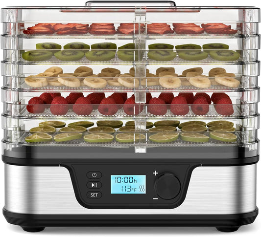 Food dehydrator with fruits and vegetables on trays