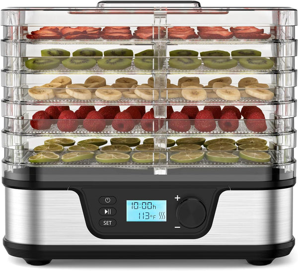Food dehydrator with fruits and vegetables on trays