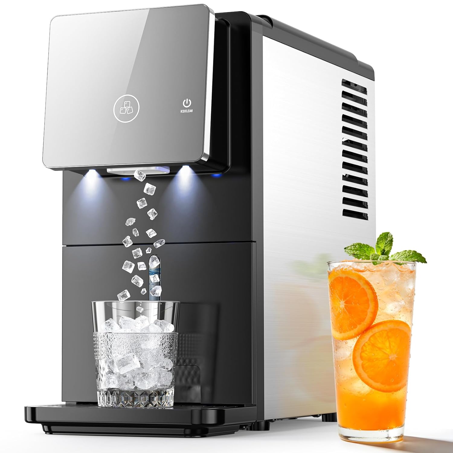 Ice maker machine with a glass of ice and a glass of orange juice on a white background