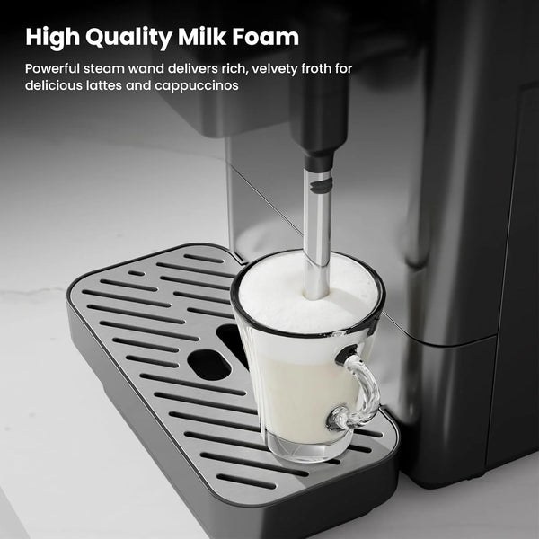 Coffee machine with steam wand frothing milk in a glass cup on a light background