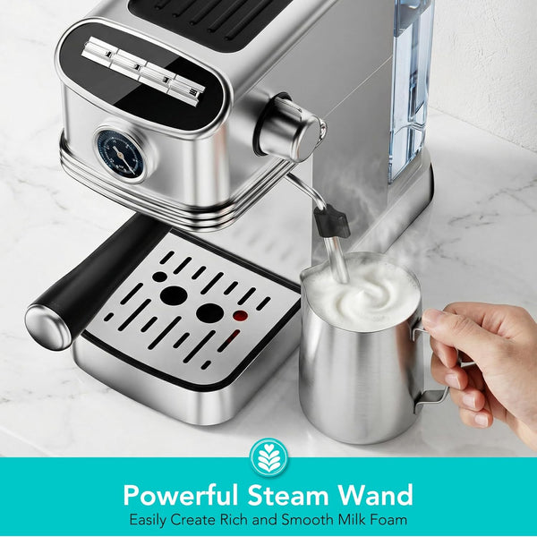 Espresso machine with steam wand being used to froth milk, on a marble countertop.