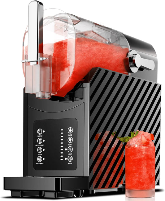 Black and silver cocktail mixer with a red drink and glass on a white